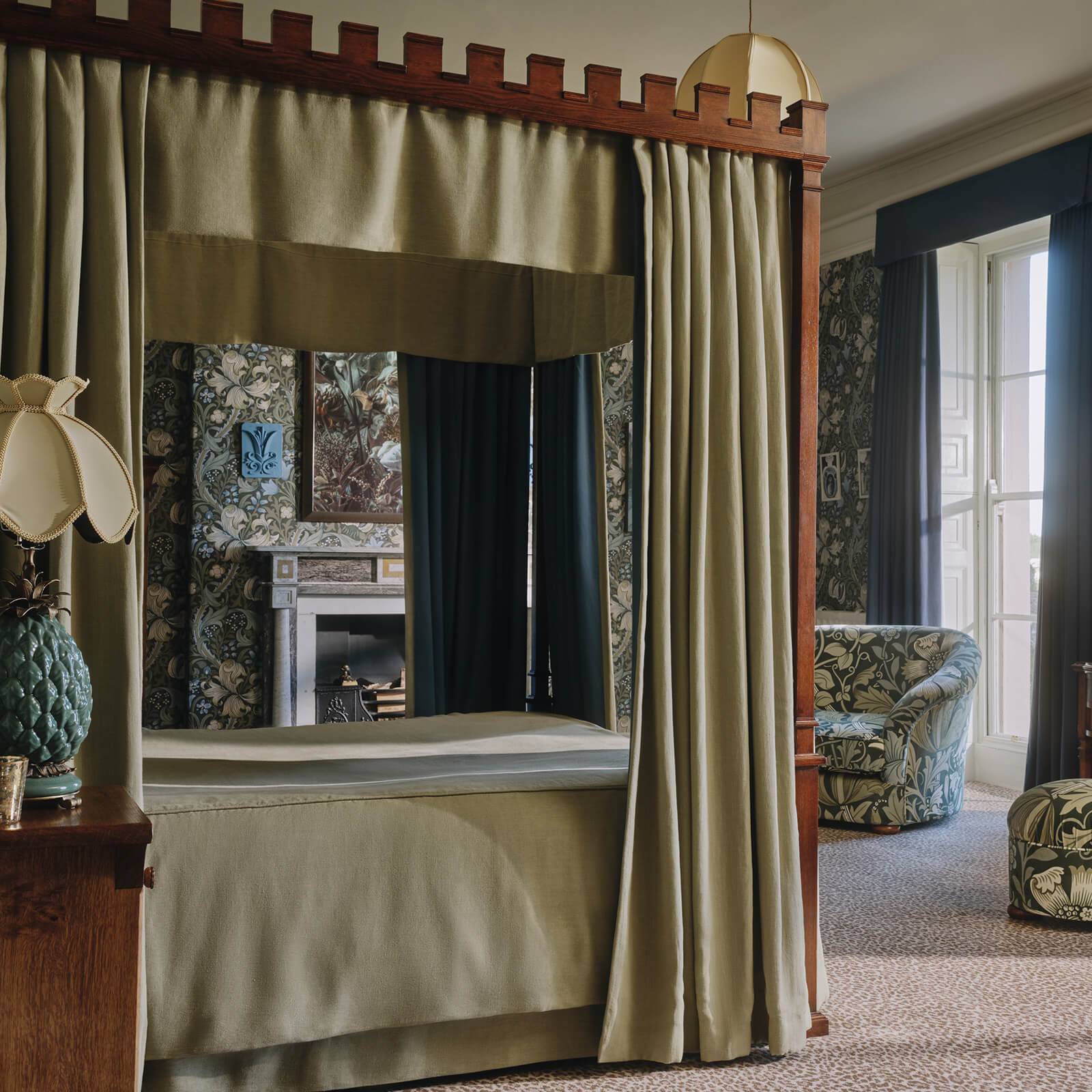 a room with a bed and a fireplace