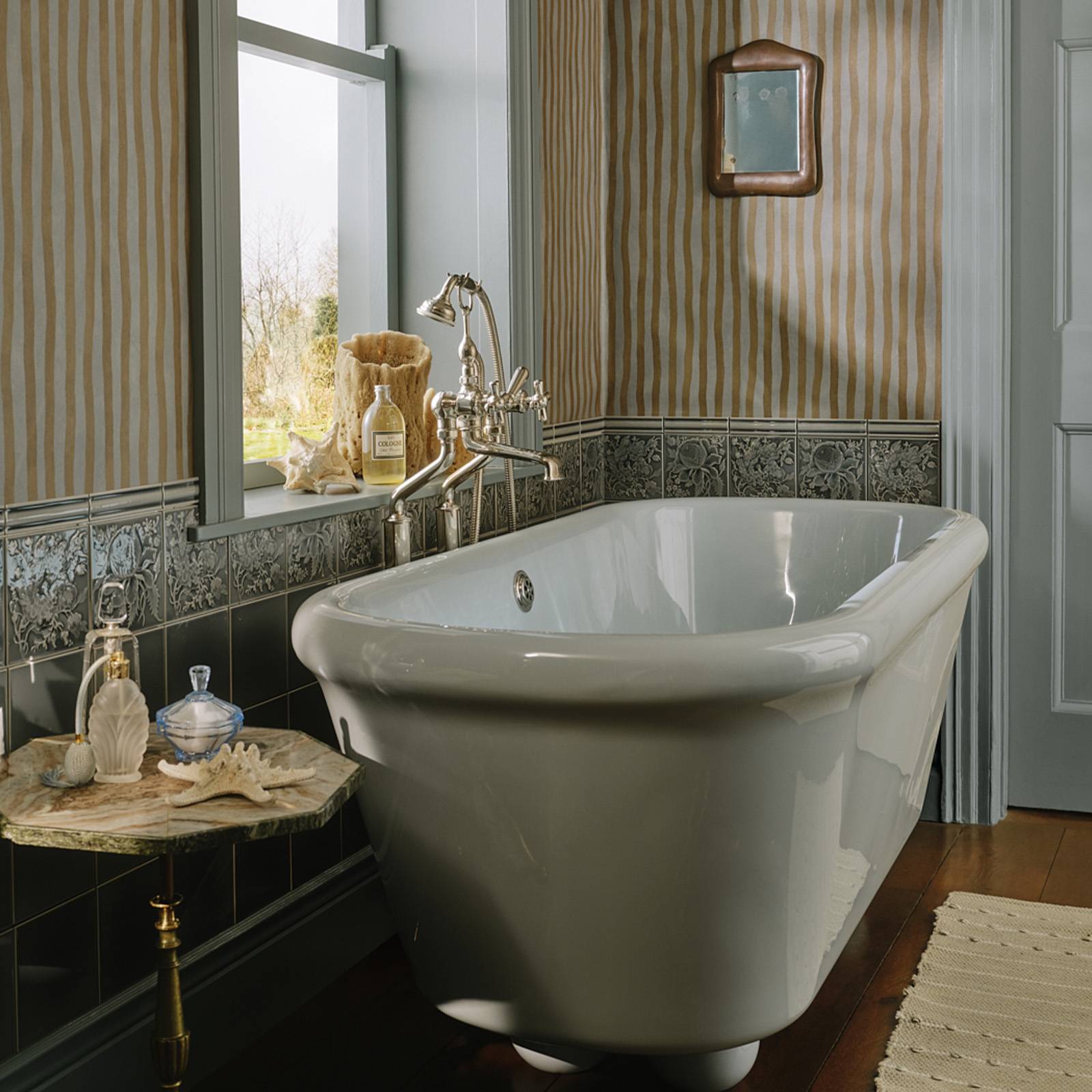 a bathroom with a tub and a rug
