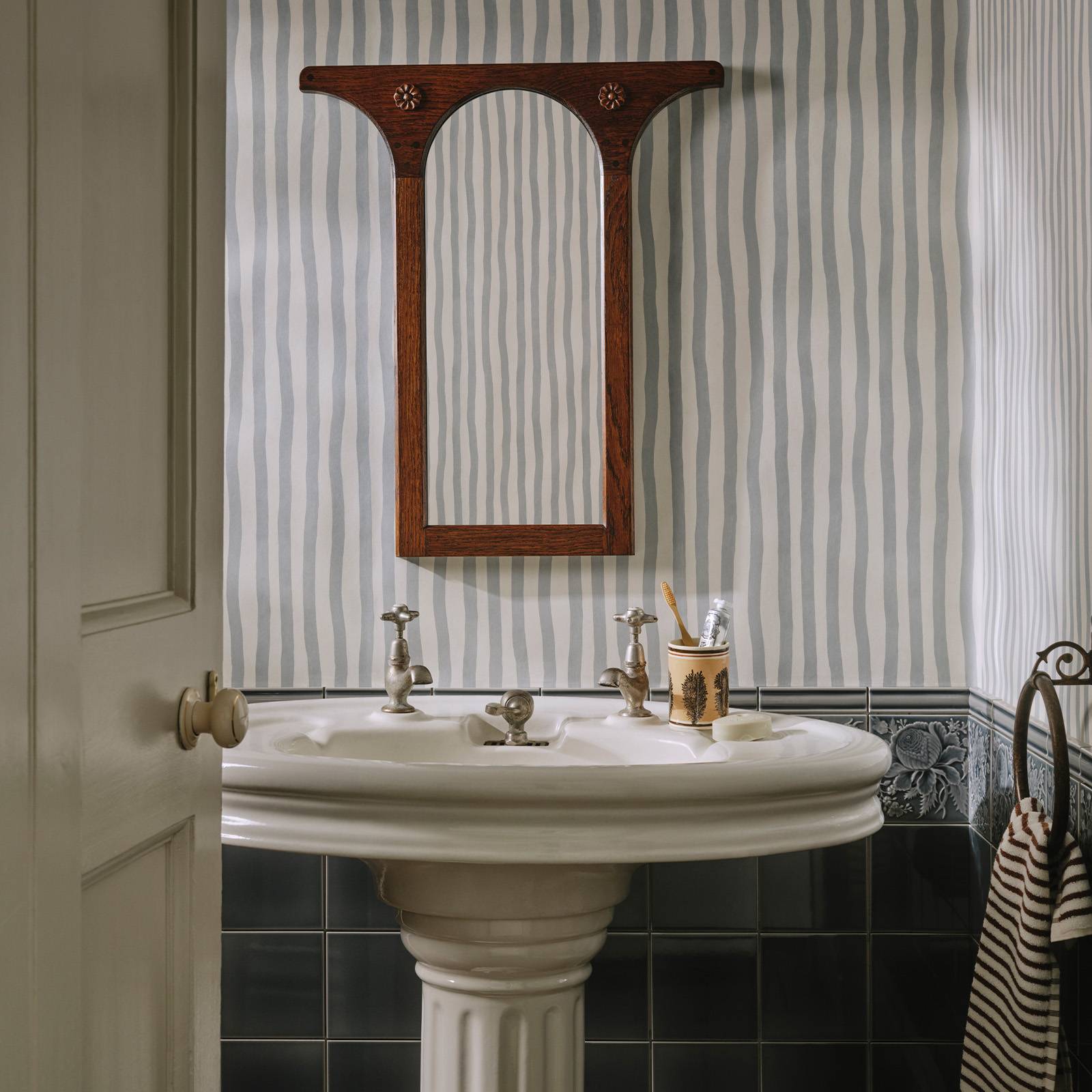 a bathroom with a mirror and a sink